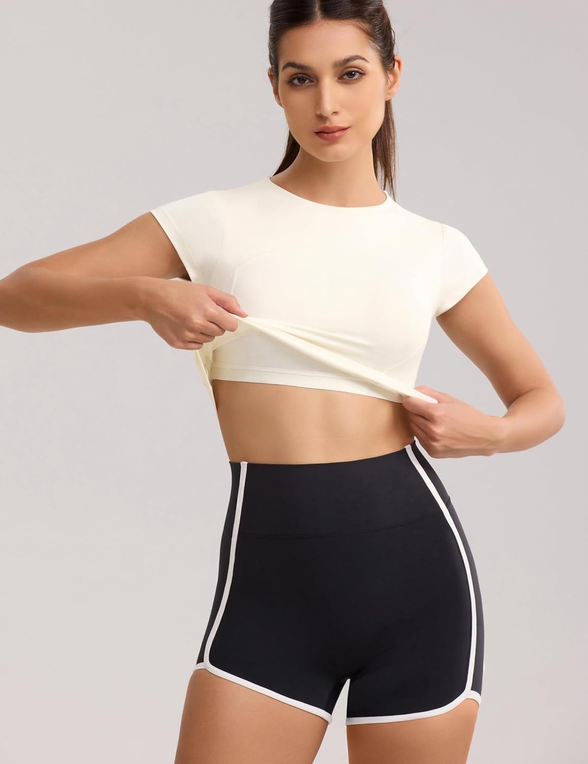 image:imageENERBLOOM Workout Crop Tops for Women Yoga Short Sleeve Mild Support Slim Fit Cropped Athletic Shirts Gym Tee Built in BraCreamy White